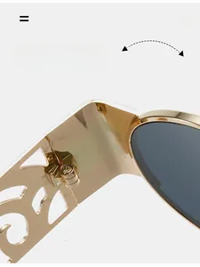 Detail of durable golden metal hinges with exquisite hollow-carved design on sunglasses
