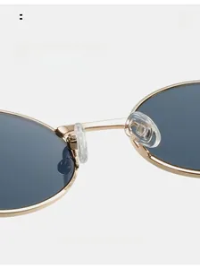 Detail of soft silicone nose pads on gold metal sunglasses for pressure-free comfort