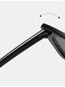 Detailed macro view of durable reinforced metal hinges on black polished sunglasses