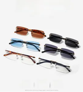 Flat lay of square rimless sunglasses in various gradient colors with golden temples