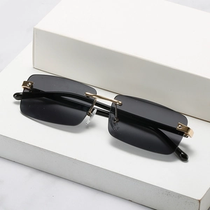 Modern rimless rectangular sunglasses with gradient lenses and gold metal hardware