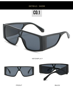 Détails macro de lunettes de soleil shield surdimensionnées avec monture noire et encoche