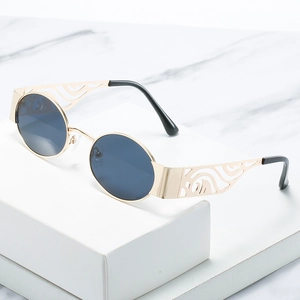Retro oval metal sunglasses with gold frames, blue lenses and hollow textured temples