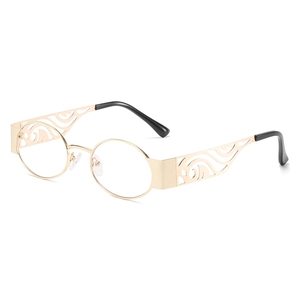 Retro golden oval metal sunglasses with hollow carved temple design and black earpieces