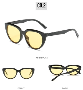 Three-angle display of black cat eye sunglasses with yellow lenses from front and side views