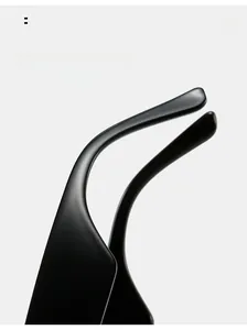 Detail of matte black ergonomic curved mirror legs on cat eye sunglasses for comfort