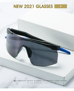 Detail of grey one-piece oversized sports sunglasses with blue non-slip temple tips