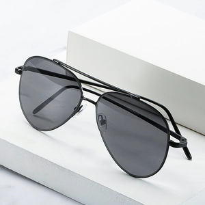 Classic black metal aviator sunglasses with double bridge on minimalist marble background
