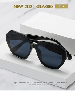 Macro detail of black polygonal sunglasses showing wavy temples and high-gloss finish
