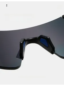 Macro view of adjustable soft blue anti-slip nose pads on black cycling sunglasses