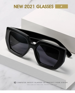 Macro detail of black square frame sunglasses on minimalist geometric props