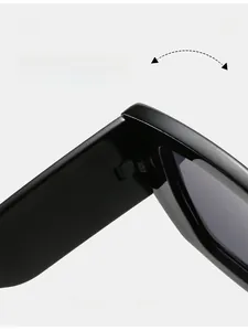 Macro detail of durable hinges on retro square sunglasses with a polished black finish