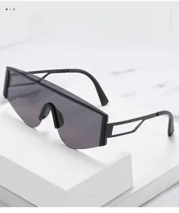 Close-up of oversized square sunglasses with black frame and hollow temple design