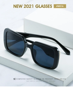 Detail of square sunglasses with gold Greek fret pattern on temples and blue lenses