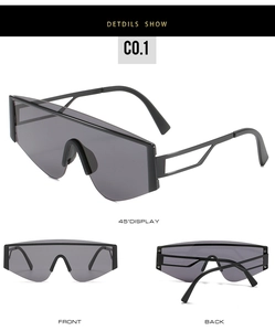 Detail view of large frame oversized sunglasses with geometric hollowed-out metal temples