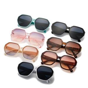 Oversize octagonal sunglasses in colorful frames with trendy wave-shaped temples