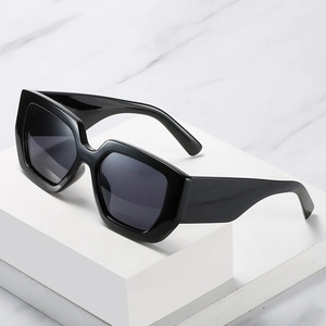 Retro oversized square sunglasses with wide legs and glossy black geometric frames