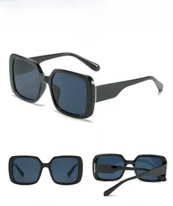 Three perspectives of oversized black square sunglasses with dark lenses in white background