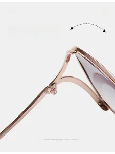 Close-up of durable metal hinge on stylish rose gold polygonal cat-eye sunglasses