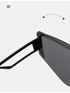 Detail of durable metal hinge connection on oversized square ocean lens sunglasses