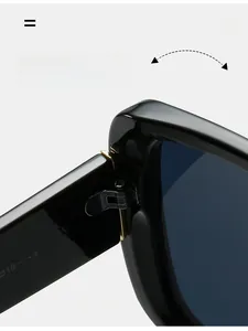 Macro view of durable metal hinge on stylish oversized black square frame sunglasses
