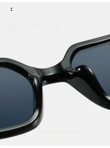 Close-up of comfortable integrated nose pads on black oversized square sunglasses