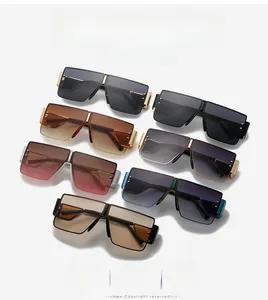 Flat lay showing seven colors of oversized flat top sunglasses with metal hinges
