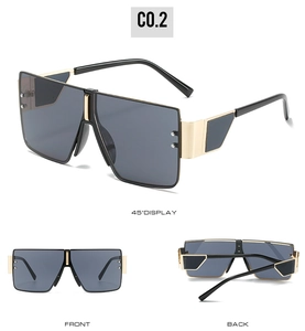 Three perspectives of oversized square sunglasses with black and gold temples and dark lenses