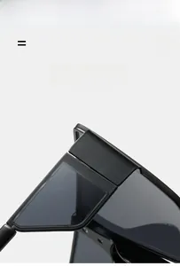 Detail view of durable metal hinges and matte texture on oversized sunglasses frame