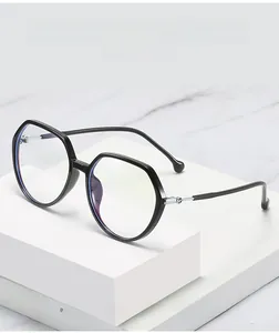 Macro shot of TR90 blue light blocking glasses with black frame and silver metal hinge detail