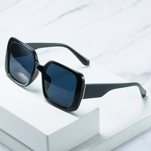 Classic oversized square sunglasses with black glossy frames and smoke lenses for women