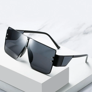 Oversized square shield sunglasses with silver rivet accents on white display stands