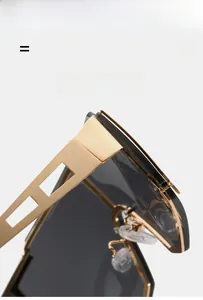 Macro detail of gold punk sunglasses showing geometric cutout temple and metal hinge