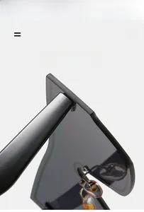 Detail of trendy oversized sunglasses featuring flexible matte black frames and soft nose pads