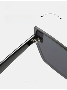 Macro detail of a durable metallic hinge on oversized flat top fashion sunglasses