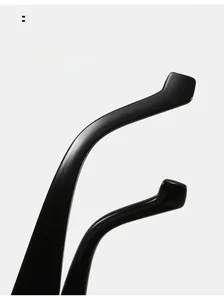 Macro detail of glossy black curved temple tips for ergonomic sunglasses comfort