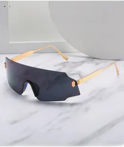 Detail of gold metal temples with linear stripes on oversized cycling sunglasses