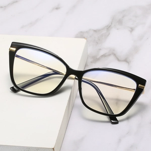 Lunettes anti-lumière bleue œil de chat TR90 noires avec branches en métal doré sur marbre