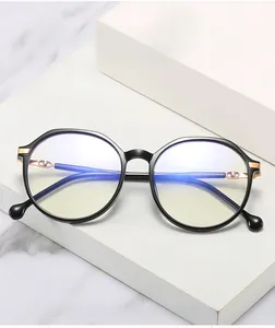 Detail of black TR90 frames with gold V logo and anti-blue light coating lenses