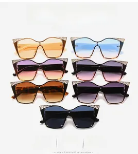 Detail showing oversized cat-eye sunglasses with ornate metal lace trim in various colors