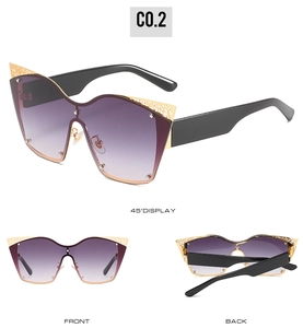 Three-view detail of oversized cat-eye sunglasses with golden lace filigree patterns