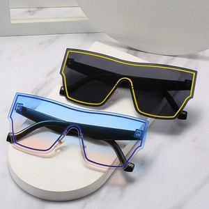 Oversized shield sunglasses with bold neon frames and gradient lenses for a modern look
