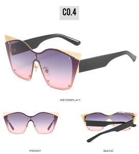 Three-way view of oversized cat-eye sunglasses with gold hollow lace metal trim