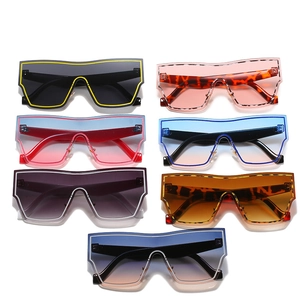 Set of seven oversized geometric shield sunglasses in various trendy color gradients