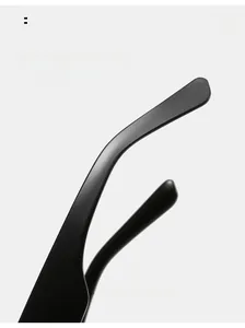 Detail of ergonomic curved mirror legs on black fashion oversized cat-eye sunglasses