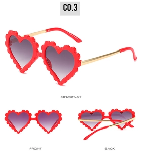 Detailed three-view display of heart-shaped kids sunglasses with red frames and gold legs