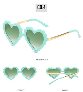 Detail view of heart-shaped flower sunglasses in mint green with metal gold temples