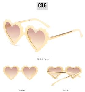 Three views of beige heart-shaped sunglasses with wavy frames and gold metal temples