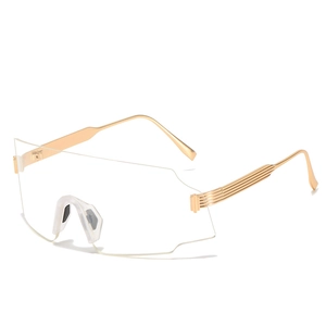 Outdoor cycling sunglasses with oversized transparent lenses and gold metal frames