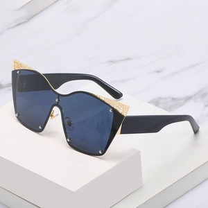 Cat eye oversized sunglasses with gold lace hollow pattern on black frame